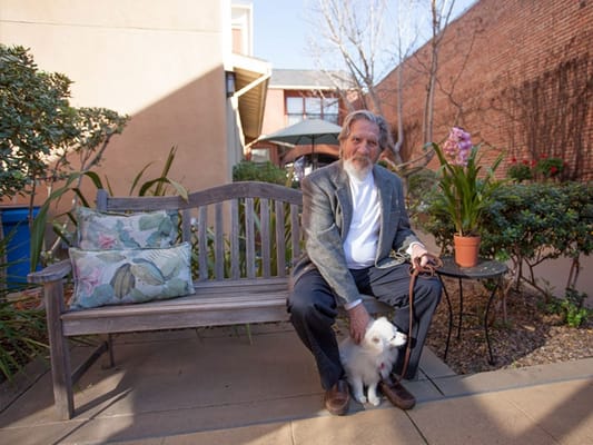 Resident enjoying time outdoors with a dog