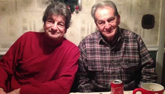 Two residents sitting together at a table