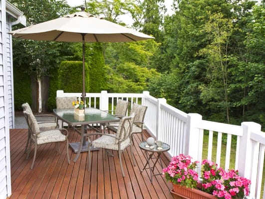 Outdoor patio with a table and seating arrangement