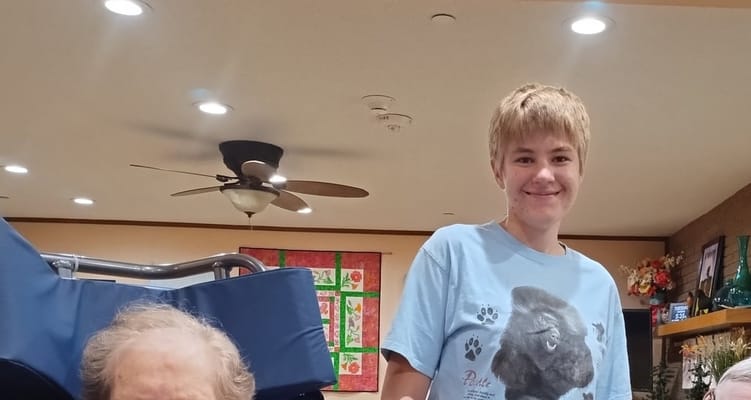 A staff member with a resident in an activity room