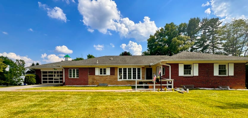 Exterior view of CareVilla Briggs Chaney with landscaped lawn.