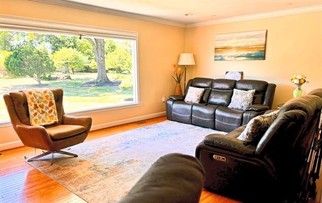 Bright common area with seating and a view of the outdoors