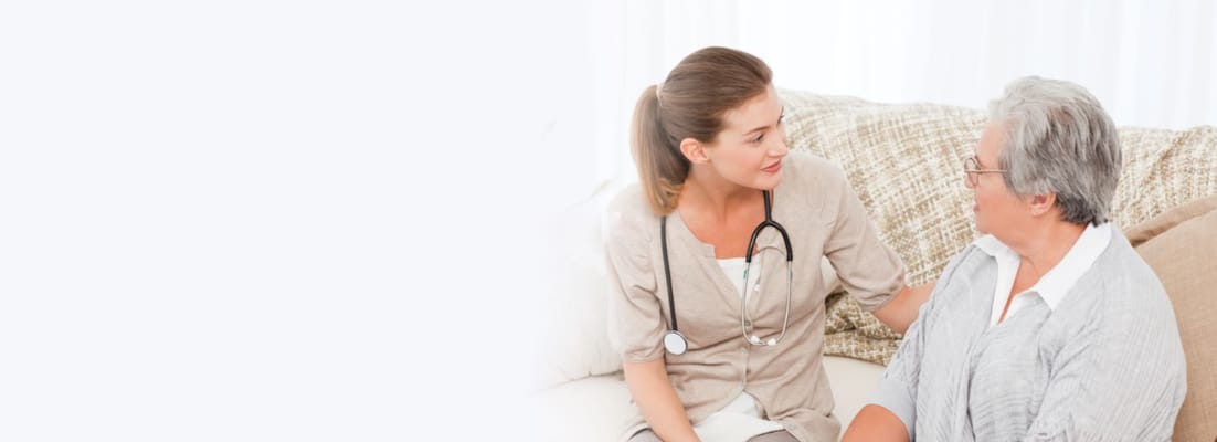 Caregiver interacting with a senior resident indoors