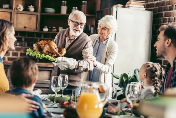 Residents enjoying a Thanksgiving meal together