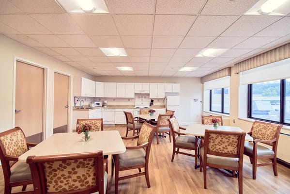 Bright dining area with tables and chairs