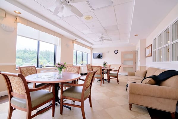Bright common area with seating and tables