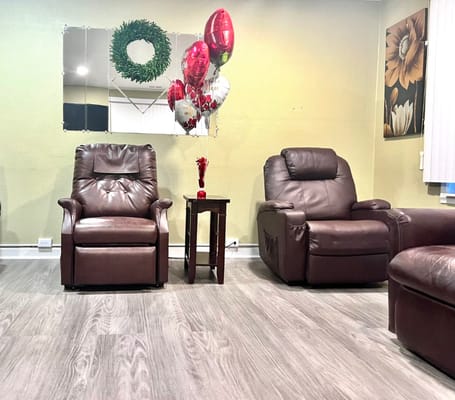 Comfortable seating area with balloons and decorations