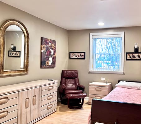 Cozy private resident room with armchair and decorations