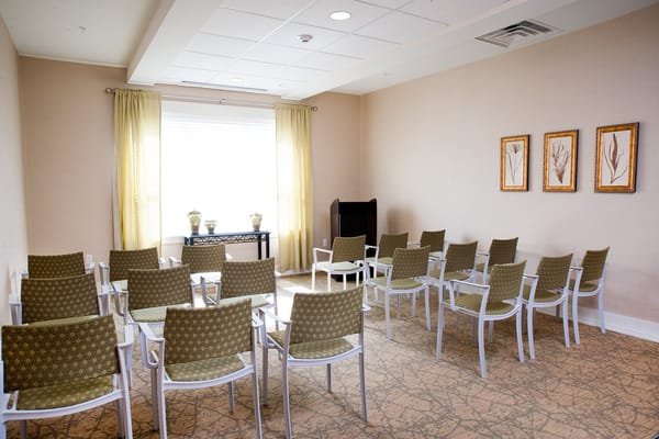Brightly lit common area with chairs arranged for gathering