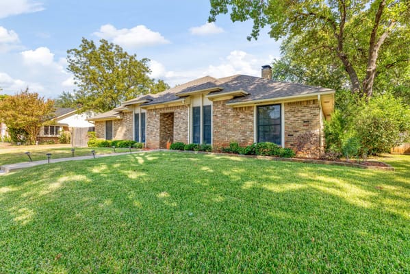 Exterior view of a well-maintained assisted living facility