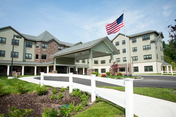 Exterior view of Braemar at Wallkill with an American flag
