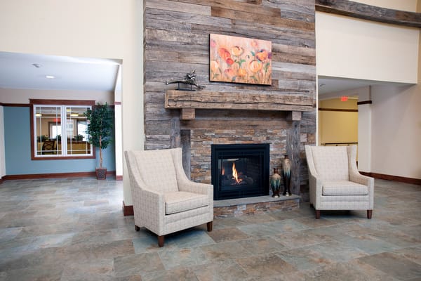 Interior view of a cozy common area with a fireplace