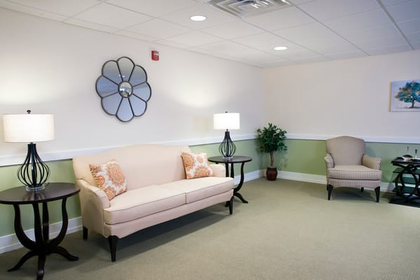 A cozy lounge area with seating and decor