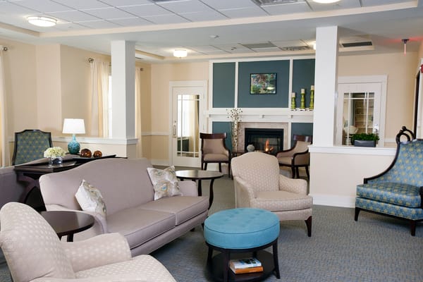 Cozy interior common area with seating and fireplace