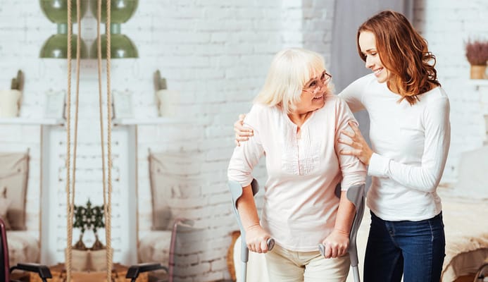 Staff assisting a resident in a caring manner