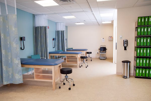 Therapy room with treatment tables and equipment
