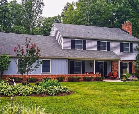 Exterior view of a residential facility with landscaped yard