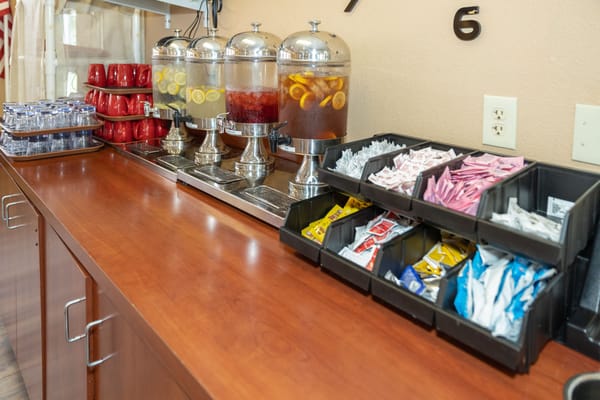 Refreshments setup with drinks and condiments