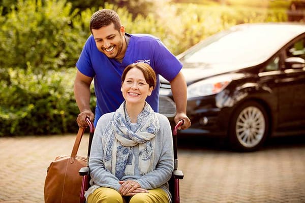 Caregiver assisting a resident in a wheelchair