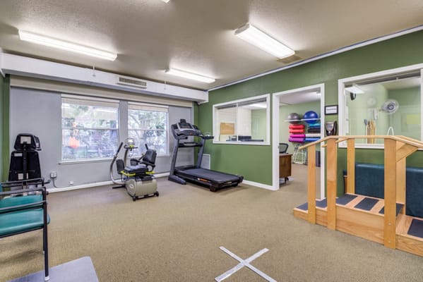 Interior view of a fitness room with exercise equipment