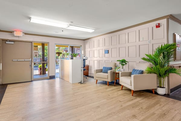 Bright interior lobby with seating area and plants