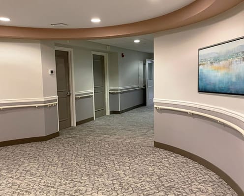 A well-lit interior corridor of the facility