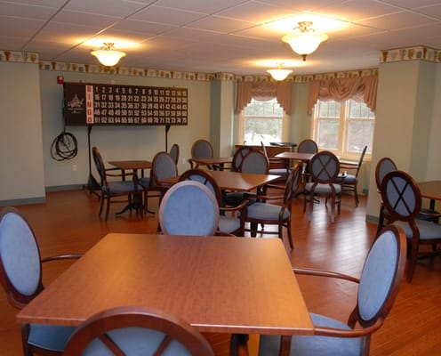 Bright common area with tables and chairs