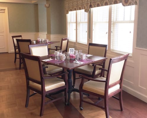 Well-set dining area in a senior living facility
