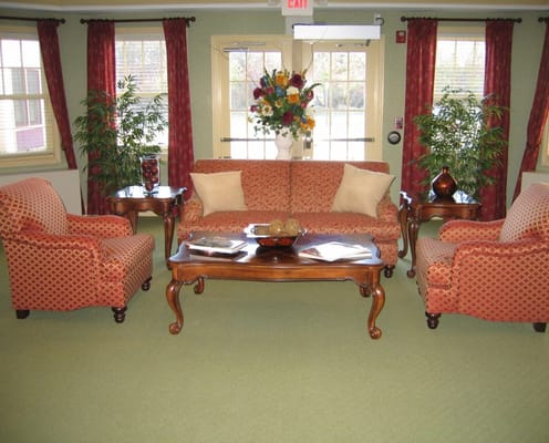 Interior common area with seating and floral arrangement