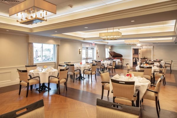 Dining room setup with tables and chairs