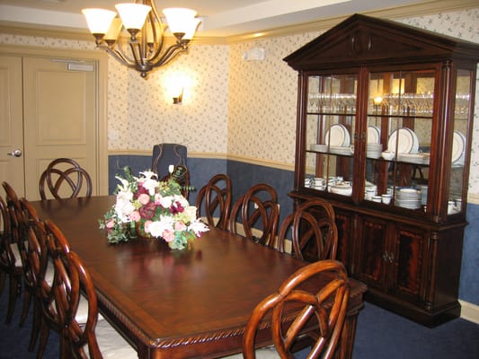 Dining room with a large table and decorative cabinet