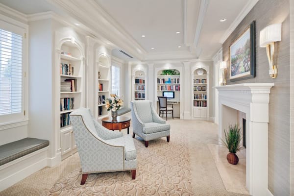 Cozy reading area with bookshelves and armchairs