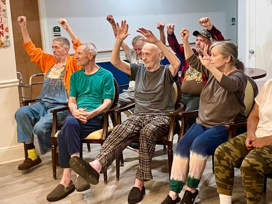 Residents engaging in a seated group activity