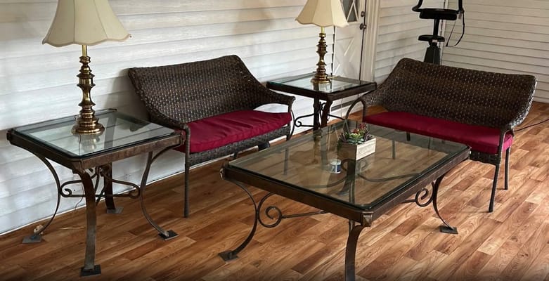 Cozy lounge area with wicker furniture and a lamp