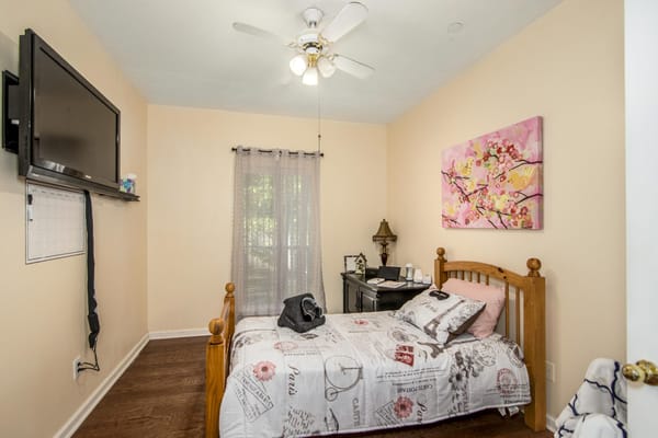 Cozy private room with a bed and TV