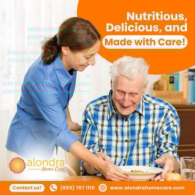 Caregiver serving food to a smiling senior man