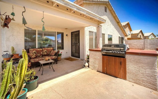 Patio with seating and barbecue grill at Angel's Senior Care