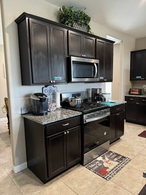 A modern kitchen setup with appliances and granite countertop