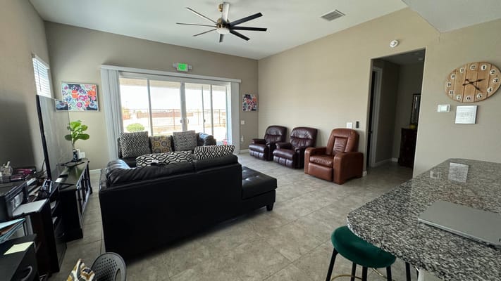 Bright common area with seating and natural light