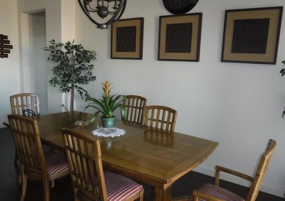 Interior view of a dining area with a wooden table and chairs