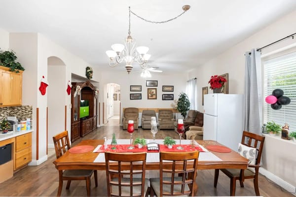 Spacious common area with dining table and seating in Arden Haven Assisted Living