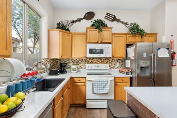 Bright kitchen with wood cabinets and modern appliances