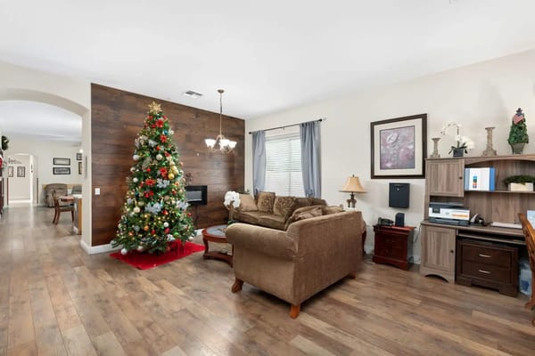 Living room with Christmas tree and cozy furniture