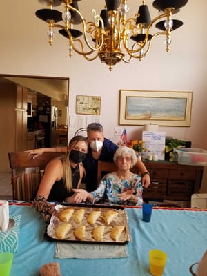 Residents and staff enjoying baked goods together