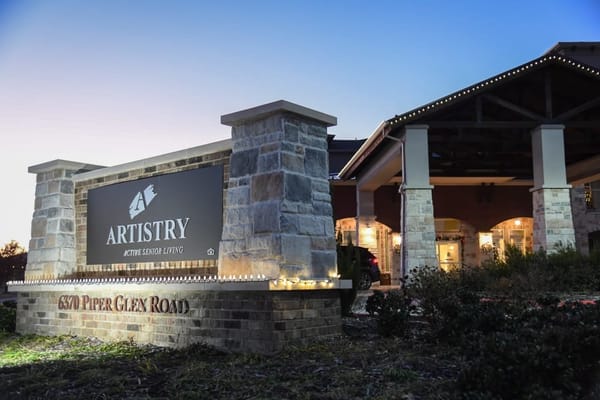 Exterior view of Artistry at Craig Ranch signage
