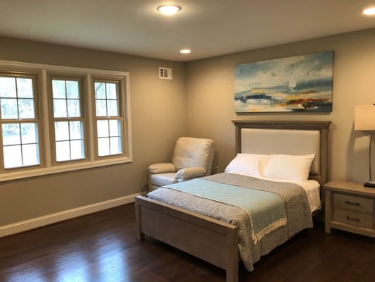 A well-furnished private resident room with bedding