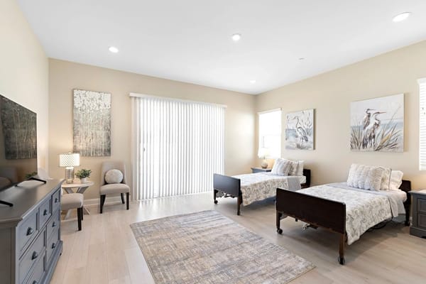 Bright, inviting resident bedroom with two beds