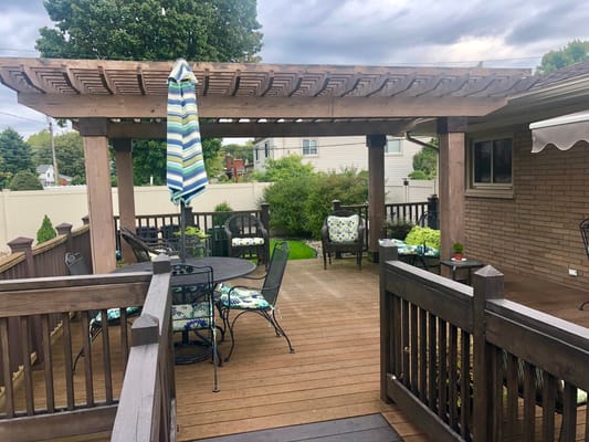 Outdoor patio area with seating and a pergola