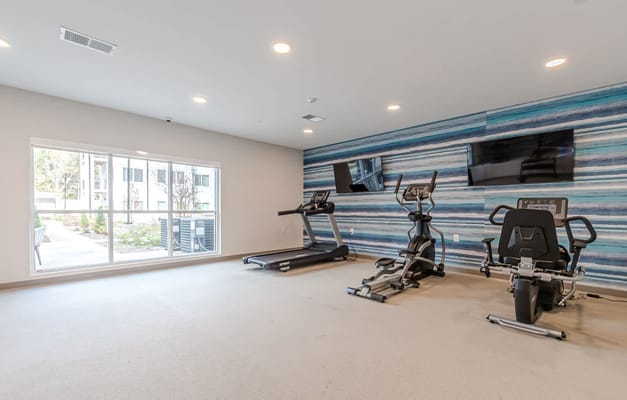 Interior view of a fitness room with exercise equipment