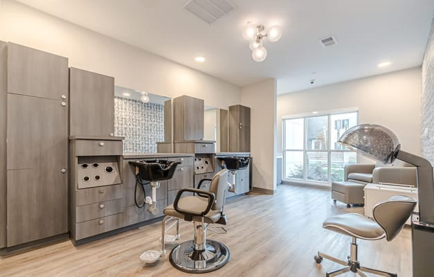 Interior view of a beauty salon with styling stations